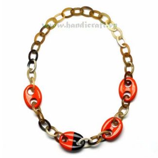 Oval horn with four red lacquer pendants